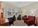 Bright home office features built-in wood desk and seating at 12960 N Marsh Dr, Port Charlotte, FL 33953