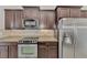 Modern kitchen with stainless steel appliances and granite countertops at 12960 N Marsh Dr, Port Charlotte, FL 33953