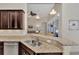 Kitchen boasts granite countertops, double sink, and breakfast bar at 12960 N Marsh Dr, Port Charlotte, FL 33953