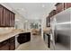 Modern kitchen featuring granite countertops and stainless steel appliances at 12960 N Marsh Dr, Port Charlotte, FL 33953