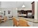 Kitchen with breakfast bar and view into dining area at 12960 N Marsh Dr, Port Charlotte, FL 33953