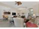 Open living room with adjoining kitchen and dining areas, featuring neutral color palette and ample natural light at 12960 N Marsh Dr, Port Charlotte, FL 33953