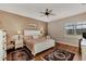 Relaxing main bedroom with hardwood floors and ceiling fan at 12960 N Marsh Dr, Port Charlotte, FL 33953
