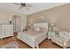 Bright main bedroom with hardwood floors and ensuite bathroom at 12960 N Marsh Dr, Port Charlotte, FL 33953