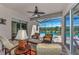 Covered patio with wicker furniture and pool view at 12960 N Marsh Dr, Port Charlotte, FL 33953