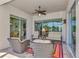 Relaxing covered patio with wicker furniture and view of pool at 12960 N Marsh Dr, Port Charlotte, FL 33953