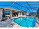 Large screened pool with patio furniture at 12960 N Marsh Dr, Port Charlotte, FL 33953