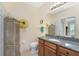 Bathroom with granite vanity and a toilet at 13488 Abercrombie Dr, Englewood, FL 34223