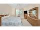 Main bedroom with king bed, dresser and window at 13488 Abercrombie Dr, Englewood, FL 34223