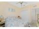 Bright bedroom featuring a double bed and built-in closet at 13488 Abercrombie Dr, Englewood, FL 34223