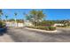 Gated community entrance with lush landscaping at 13488 Abercrombie Dr, Englewood, FL 34223
