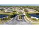 Gated community entrance with landscaping and water features at 13488 Abercrombie Dr, Englewood, FL 34223