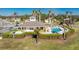 Community pool with clubhouse and lush landscaping at 13488 Abercrombie Dr, Englewood, FL 34223