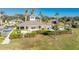 Community pool with clubhouse and lush landscaping at 13488 Abercrombie Dr, Englewood, FL 34223