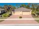 Three-car garage and attractive curb appeal at 13488 Abercrombie Dr, Englewood, FL 34223