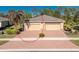 Charming single-story home with a two-car garage, paver driveway, and well-maintained landscaping at 13488 Abercrombie Dr, Englewood, FL 34223