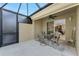 Covered patio with seating area, providing access to the interior at 13488 Abercrombie Dr, Englewood, FL 34223