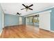 Gathering room with wood floors and access to the pool area at 13694 Begonia Cir, Port Charlotte, FL 33981