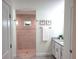 Modern bathroom with walk-in shower, granite vanity, and neutral tones at 14331 Montmarte Ave, Port Charlotte, FL 33981