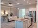 Open concept kitchen with island and stainless steel appliances at 14331 Montmarte Ave, Port Charlotte, FL 33981