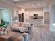Open kitchen with an island, stainless steel appliances, and light cabinets at 14331 Montmarte Ave, Port Charlotte, FL 33981