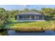Single-story home with pool and canal views at 14351 Howard Ave, Port Charlotte, FL 33953