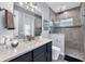 Bathroom with a walk-in shower and modern vanity at 14351 Howard Ave, Port Charlotte, FL 33953