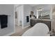 Bathroom with a freestanding tub and double vanity at 14351 Howard Ave, Port Charlotte, FL 33953