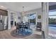 Bright dining area with table and chairs, view of pool at 14351 Howard Ave, Port Charlotte, FL 33953