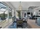 Open dining area with a view of the pool and living room at 14351 Howard Ave, Port Charlotte, FL 33953