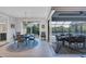 Indoor-outdoor dining space with sliding glass doors opening to pool at 14351 Howard Ave, Port Charlotte, FL 33953