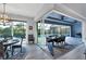Open dining area leading to a screened patio and pool at 14351 Howard Ave, Port Charlotte, FL 33953