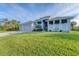 Newly built home with three-car garage and attractive landscaping at 14351 Howard Ave, Port Charlotte, FL 33953