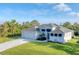 Single-Gathering home with three-car garage and nicely landscaped yard at 14351 Howard Ave, Port Charlotte, FL 33953