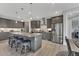 Large kitchen with island, gray cabinets, granite countertops, and stainless steel appliances at 14351 Howard Ave, Port Charlotte, FL 33953