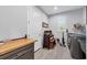 Convenient laundry room with built-in shelving and countertop at 14351 Howard Ave, Port Charlotte, FL 33953