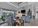 Living room with comfortable seating and views to the pool and patio at 14351 Howard Ave, Port Charlotte, FL 33953