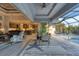 Open living space with access to the pool and kitchen at 14351 Howard Ave, Port Charlotte, FL 33953