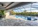 Inviting pool and spa with a screened enclosure at 14351 Howard Ave, Port Charlotte, FL 33953
