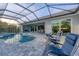 Relaxing pool and patio with lounge chairs at 14351 Howard Ave, Port Charlotte, FL 33953