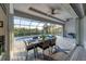 Relaxing pool area with outdoor dining and water views at 14351 Howard Ave, Port Charlotte, FL 33953