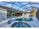 Pool and spa with covered patio and views at 14351 Howard Ave, Port Charlotte, FL 33953