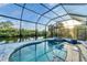 Relaxing screened pool and spa with water views at 14351 Howard Ave, Port Charlotte, FL 33953