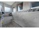 Walk-in shower with built-in seat and pebble flooring at 14351 Howard Ave, Port Charlotte, FL 33953