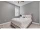 Guest bedroom with comfortable bed and window with blinds at 18651 Dayspring Pl, Venice, FL 34293