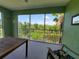 Relaxing screened balcony overlooking a tranquil pond and lush landscape at 2020 Willow Hammock Cir # 301, Punta Gorda, FL 33983