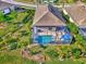 Aerial view showcasing a home with a private pool and lush landscaping at 2148 La Palma Ave, Port Charlotte, FL 33953