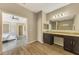 Elegant bathroom with double vanity, granite countertop, and view of bedroom at 2148 La Palma Ave, Port Charlotte, FL 33953