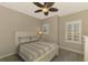 Serene bedroom with queen bed and ceiling fan at 2148 La Palma Ave, Port Charlotte, FL 33953