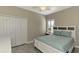 Bright bedroom with a queen-size bed and plenty of natural light at 2148 La Palma Ave, Port Charlotte, FL 33953